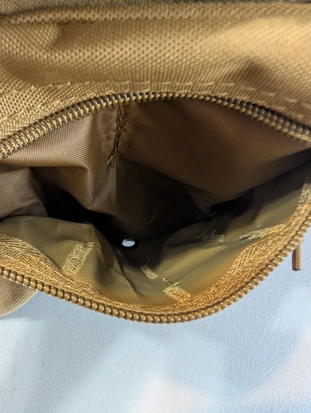 New tan tactical sling pack with holster